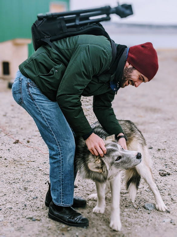 Luca interacting with a dog