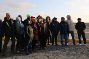 A group from the Arctic Remote Energy Networks Academy (ARENA) tours the Innavik Hydro site in Inukjuak, October 2024. Representatives from Iceland, Norway, Greenland, Alaska, and Nunavut gathered to hear from local leaders about the challenges and successes of bringing clean energy to this Arctic community. A group from the Arctic Remote Energy Networks Academy (ARENA) tours the Innavik Hydro site in Inukjuak, October 2024. Representatives from Iceland, Norway, Greenland, Alaska, and Nunavut gathered to hear from local leaders about the challenges and successes of bringing clean energy to this Arctic community.