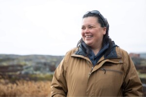 Sarah Lisa Kasudluak, vice president of Pituvik Landholding Corporation, beams as she looks out over the land in her home community of Inukjuak in Arctic Quebec. Through the efforts of Kasudluak and her colleagues, the town has replaced diesel fuel with clean
hydroelectric power.